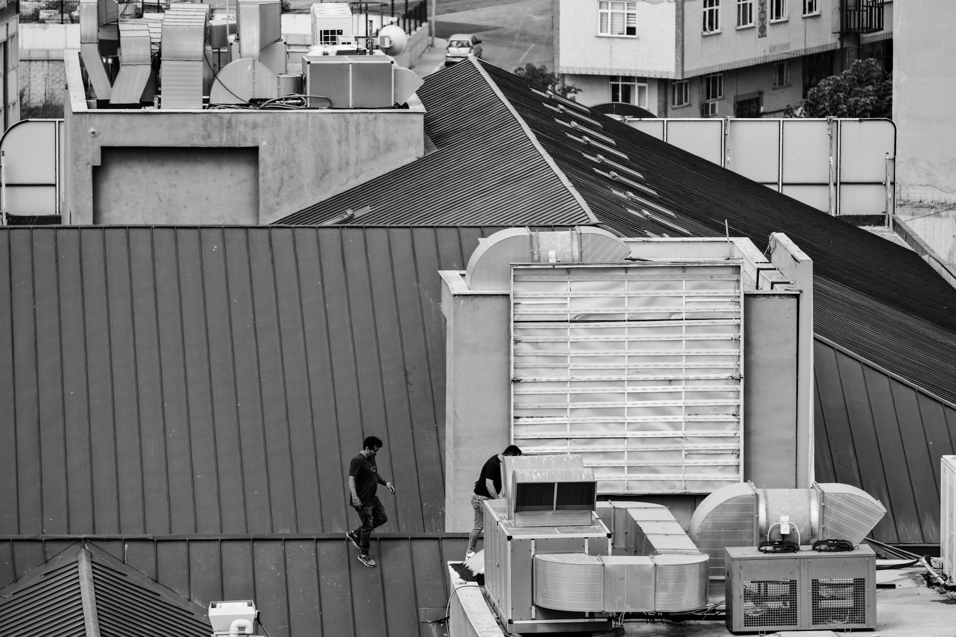 MJN Facilitate technician servicing commercial HVAC units